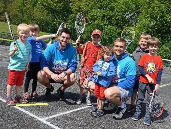 Lead coaches Ryan Bagshaw and Luis Sylvester, pictured with children who took part in the mini tennis red sessions at Bingham Park.