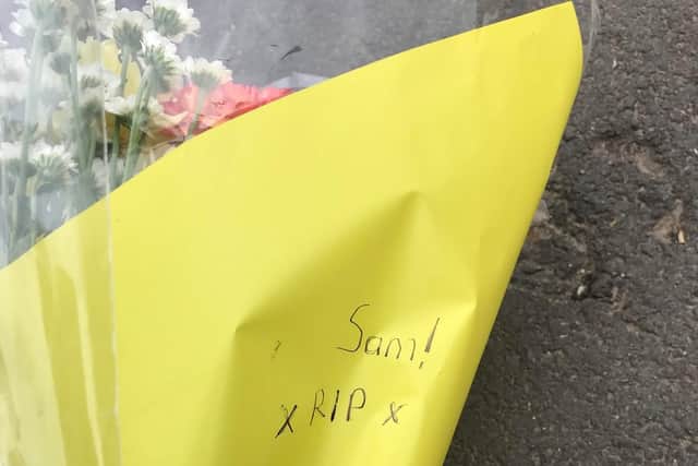 People have begun to leave floral tributes to murder victim, Sam Baker