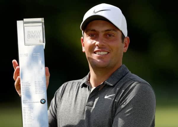 Italy's Francesco Molinari poses with the trophy after winning the 2018 BMW PGA Championship at Wentworth Golf Club, Surrey.