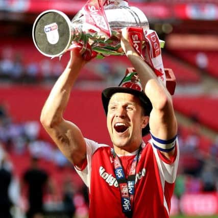 Richard Wood celebrates with the trophy after the Sky Bet League One Final at Wembley Stadium