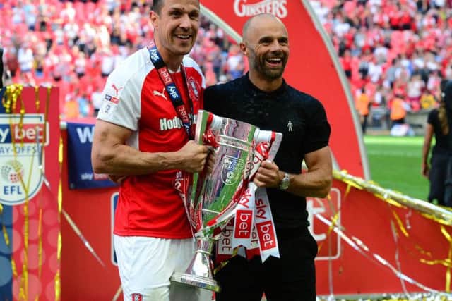 Goal-hero Richard Wood and Paul Warne with the League One Play-Off trophy