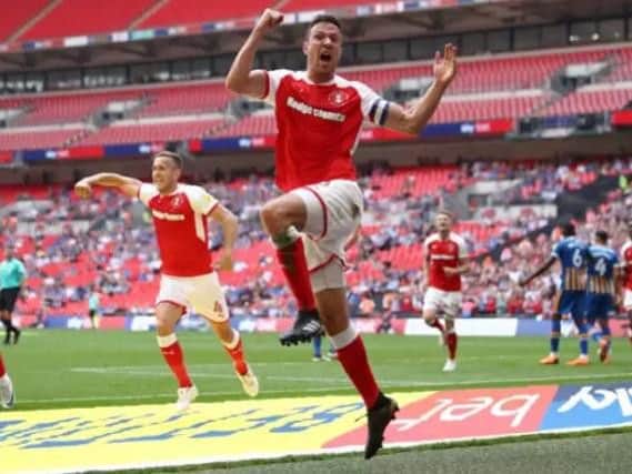 Richard Wood celebrates one of his two goals for Rotherham United.