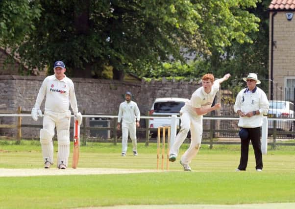 Oliver Blackburn, pictured bowling for Elsecar as Tickhill batsman Liam Johnson watches on. Picture: Marie Caley NDFP TickhillvElsecar MC 8