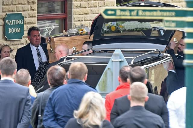 Mourners pay their respects.