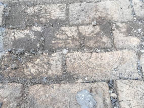 Wooden cobbles unearthed on Hodgson Street. Picture: Nigel Humberstone.