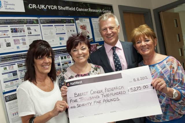 The 12th annual Cancer Research Fancy Dress Ball has raised Â£5275 for the Royal Hallamshire Hospital. Presenting the cheque to Proffessor Malcolm Reed are event organisers Sharon Beresford, Michele France and Barbara France