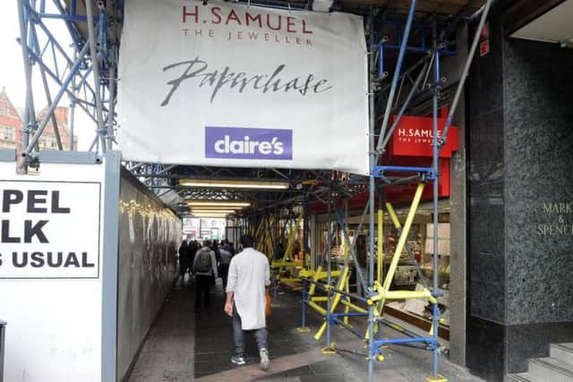 Scaffolding and hoardings along the footpath on Fargate. Picture: Andrew Roe