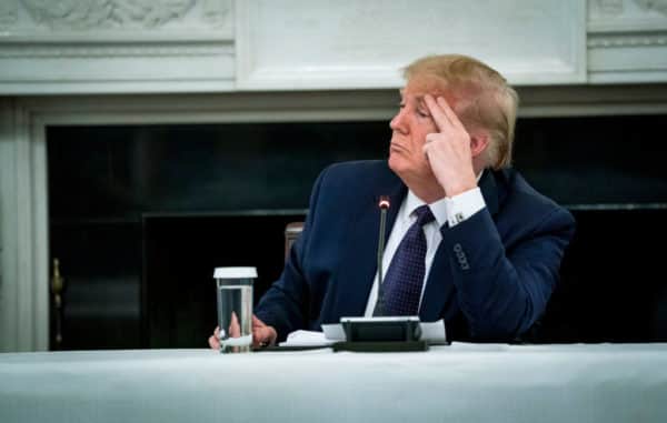 President Donald Trump reveals that he is taking hydroxychloroquine against Covid-19 as he participates in a roundtable with Restaurant Executives and Industry Leaders in the State Dining Room of the White House (Photo: Doug Mills/The New York Times)