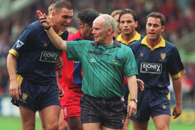 Red cards: 26. Yellow cards: 407. (Photo credit: Mike Cooper/ALLSPORT/Getty)
